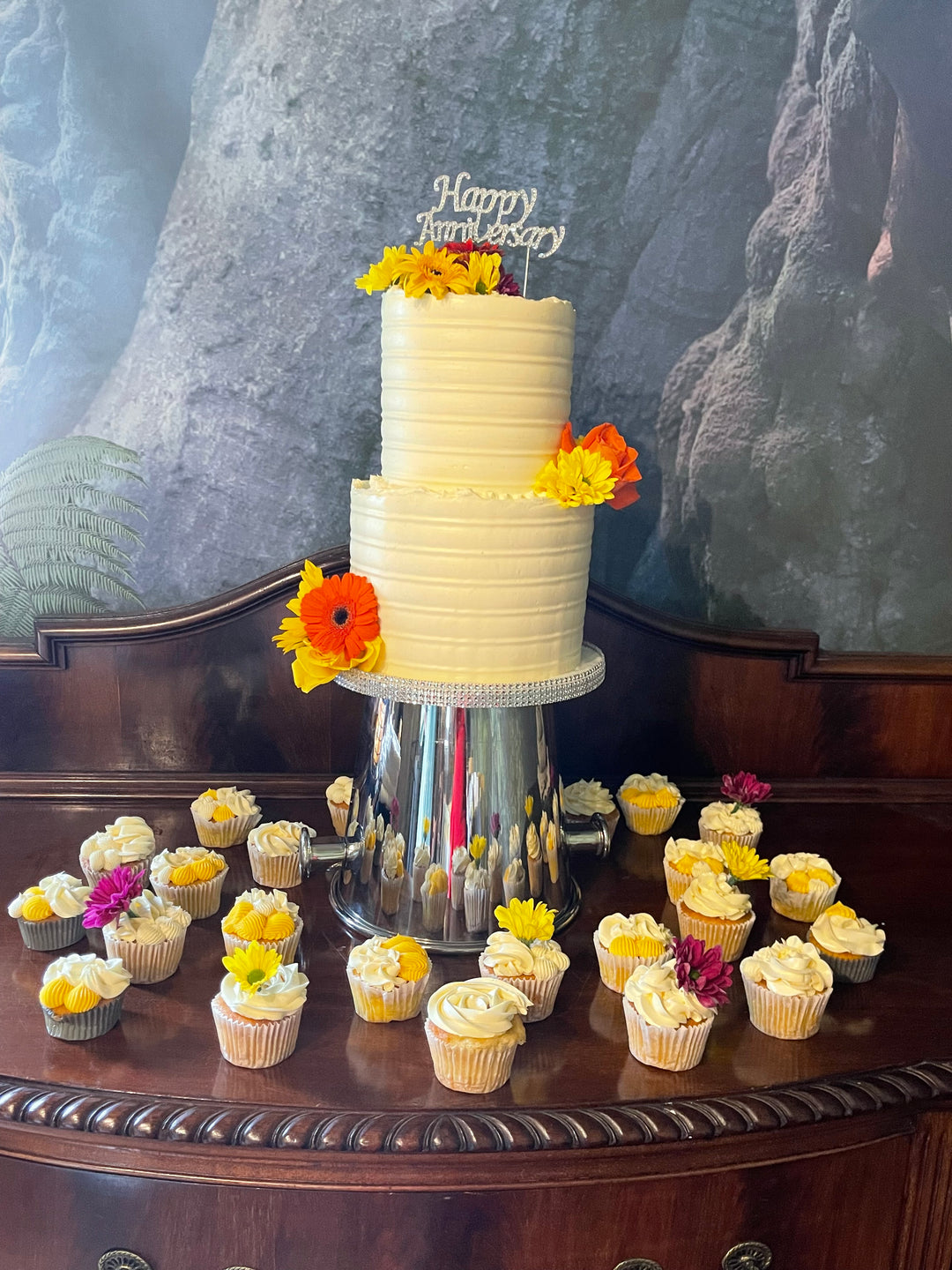 Two Tiered Floral Wedding Cake and Matching Cupcakes